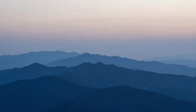 Desktop wallpaper of layered blue mountain ridges at twilight, minimal, soft gradients, generated at 16:9